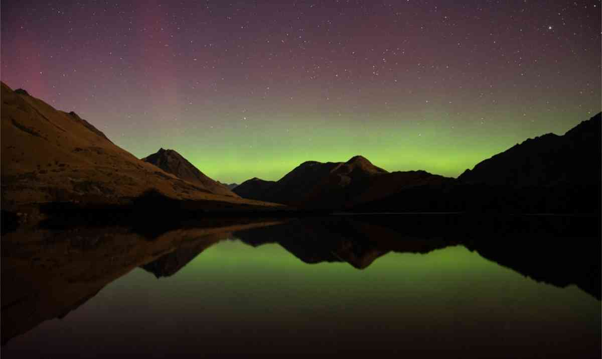Lake Wakatipu with the Southern lights shining in the sky