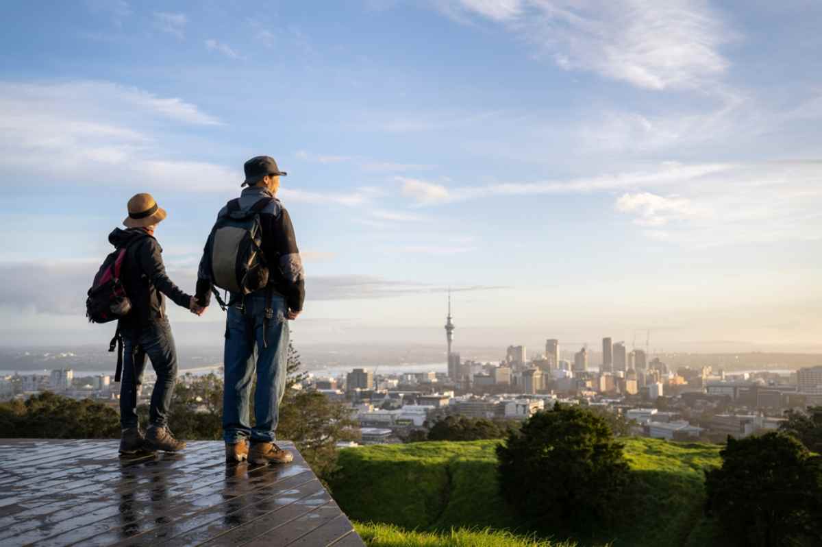 Travelers overlooking Auckland from the heights
