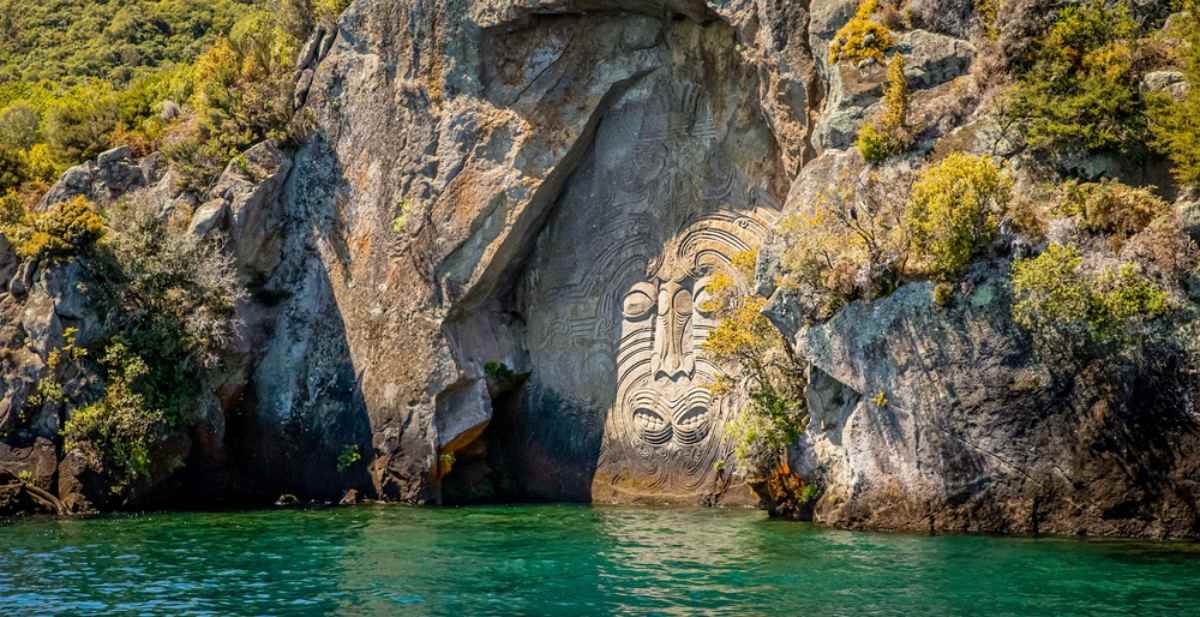 Maori face carved into a rock in Lake Taupo